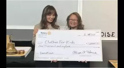 Rotary Club of Edmonds presents check to Clothes for Kids