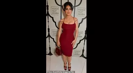 Salma Hayek, 57, puts on a very busty display in a plunging red dress