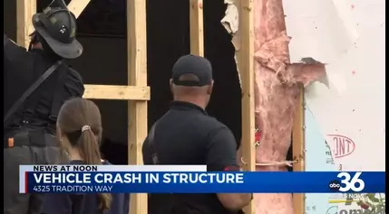 Car crashes into home, displaces four residents