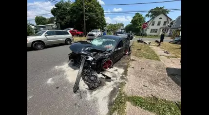 Car collision injuries three and damages a house in Hamden