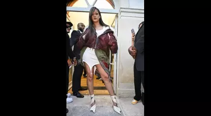 Rihanna Gets Edgy in White Tank Minidress and Cropped Jacket for A$AP Rocky’s Debut Paris Fashion Week Show