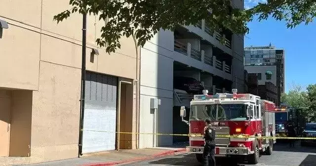 Driver Hospitalized After Hitting Parked Car in Parking Garage, Sending it Dangling Over Ledge