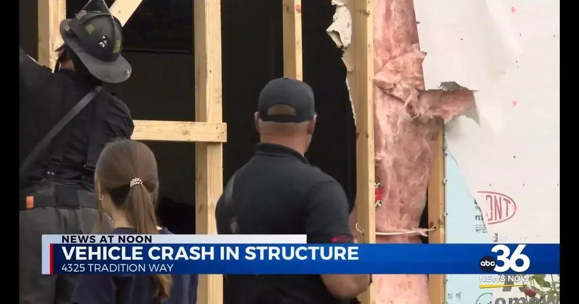 Car crashes into home, displaces four residents