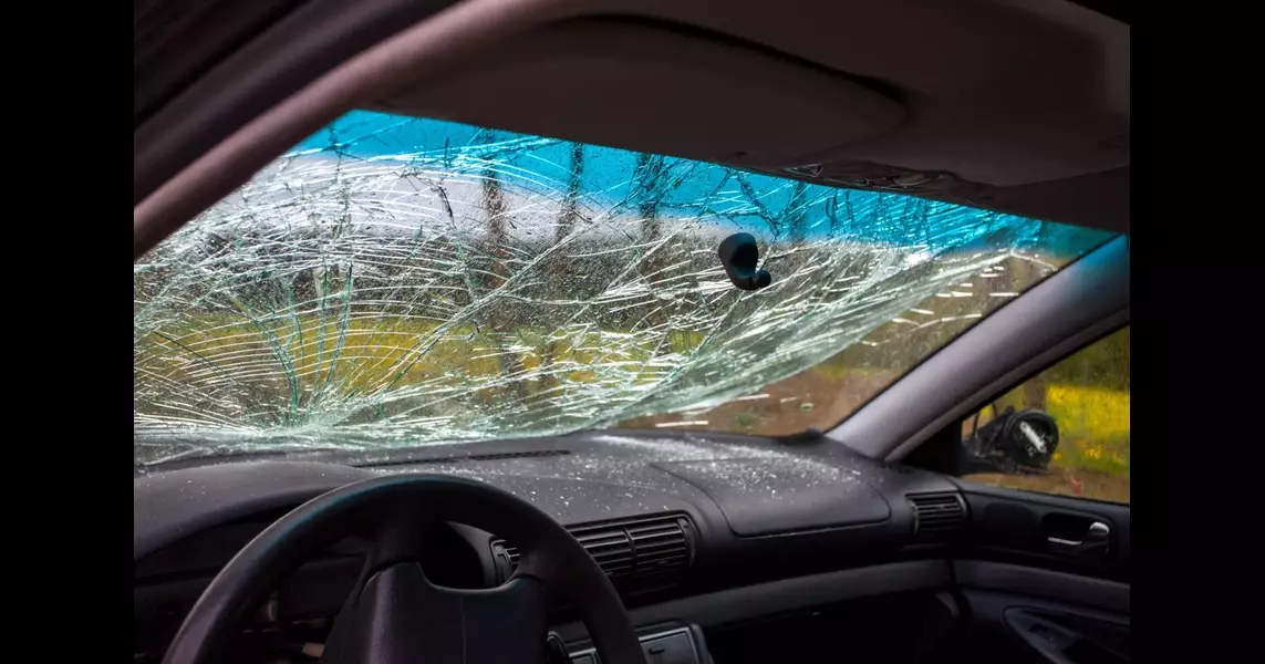 WATCH: Large Piece Of Metal Impales Car Windshield As It Cruises On Highway