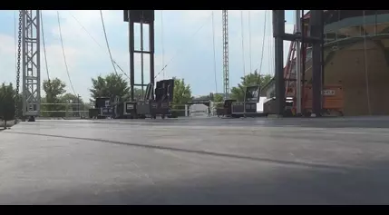 Volunteers prepare the stage for music festival in Memorial Park