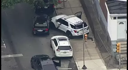 Police SUV with lights, sirens on collides with car in West Philadelphia, police say