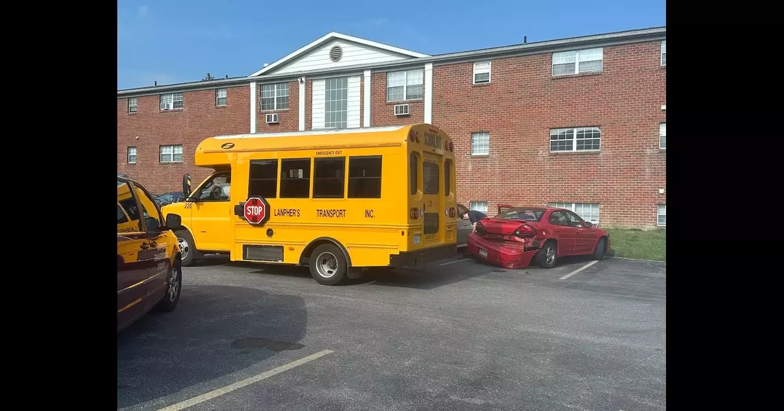 Car hits Liverpool school bus with children inside at Salina apartment complex