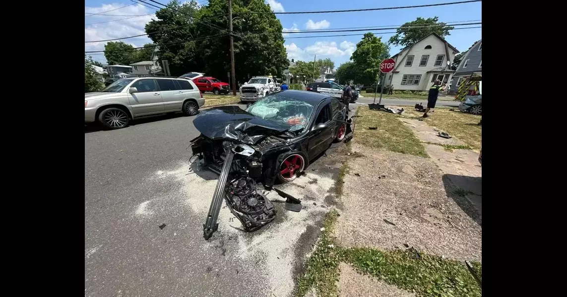 Car collision injuries three and damages a house in Hamden