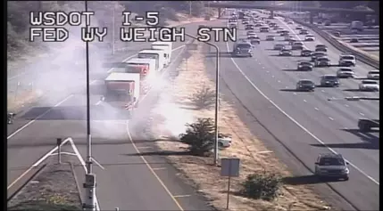 Car fire on northbound I-5 in Federal Way triggers brush fire