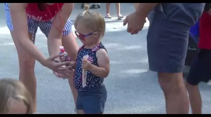 Neighborhood kids festively celebrate their Annual J.E. George Boulevard Parade