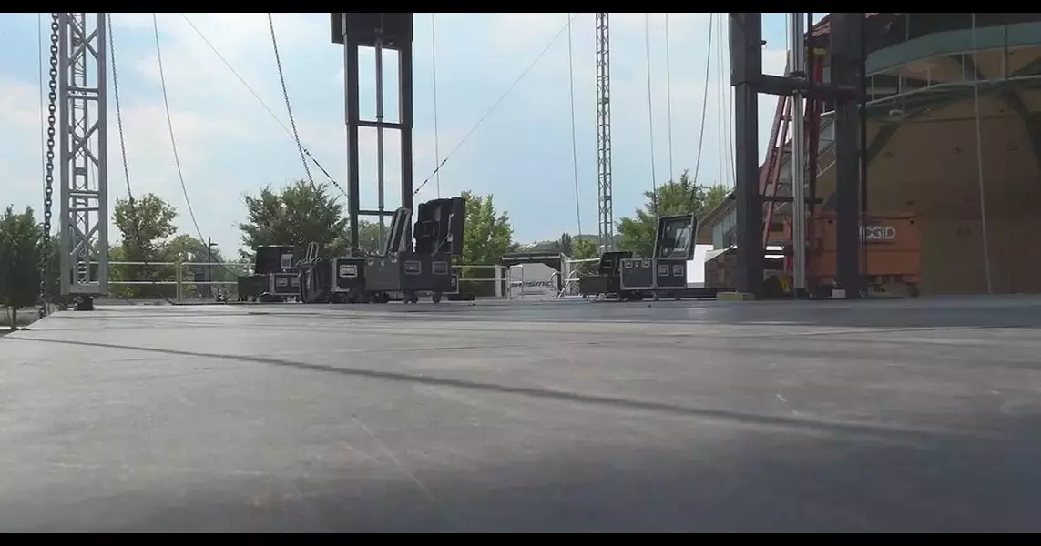 Volunteers prepare the stage for music festival in Memorial Park