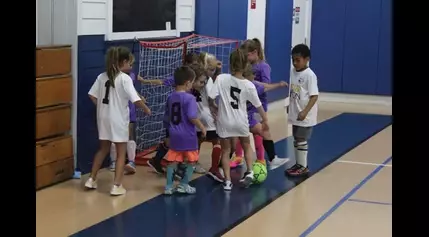 Kids take soccer indoors, adult football on the outdoor field