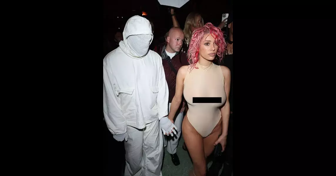 Bianca Censori Debuts New Look At Paris Fashion Week Accompanied By Kanye In A “Beekeeper Suit”