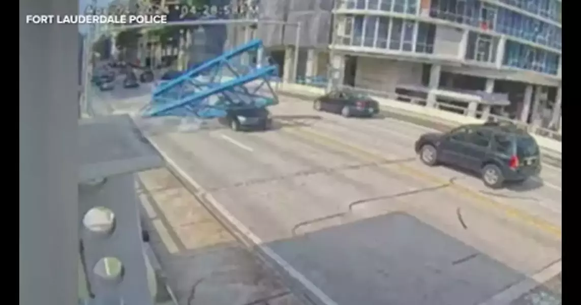 Woman walks away from FL construction accident after heavy crane crushes car