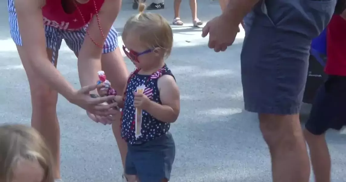 Neighborhood kids festively celebrate their Annual J.E. George Boulevard Parade