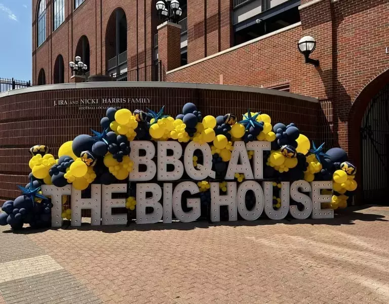 LOOK: Michigan “smokes out haters” with food at BBQ at the Big House