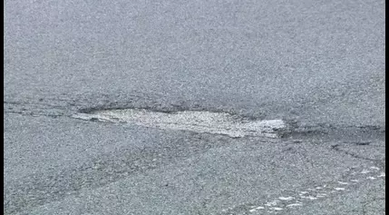 Prince George’s County woman seeking compensation after she says a massive pothole damaged her car