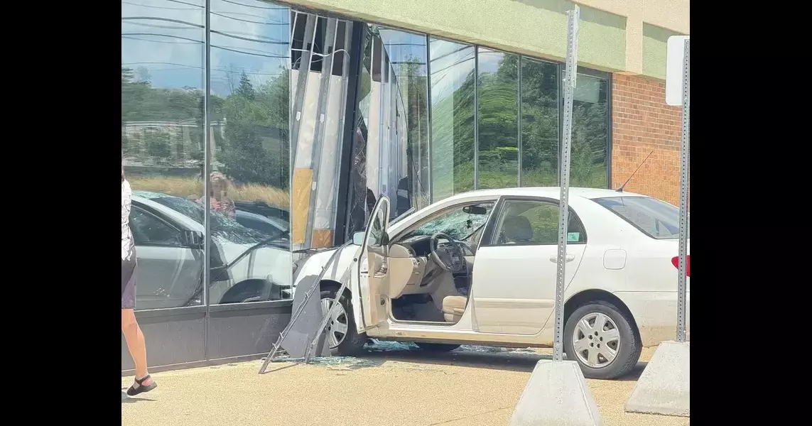 Driver crashes car through store window in Frandor