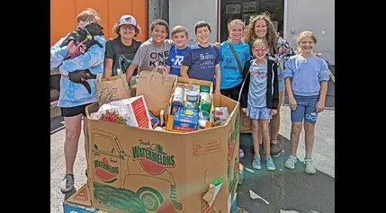 Area children collecting food donations for “Christmas in July”