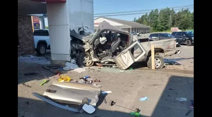 Man injured when truck crashes into Houlton car dealership