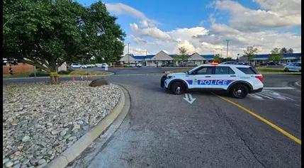 One hospitalized, another in custody after pedestrian hit by car near Walmart