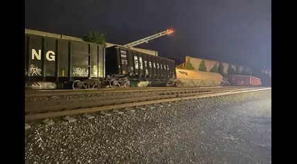 Freight train cars derail, striking wall that collapsed garage buildings in Fredericksburg, Va.