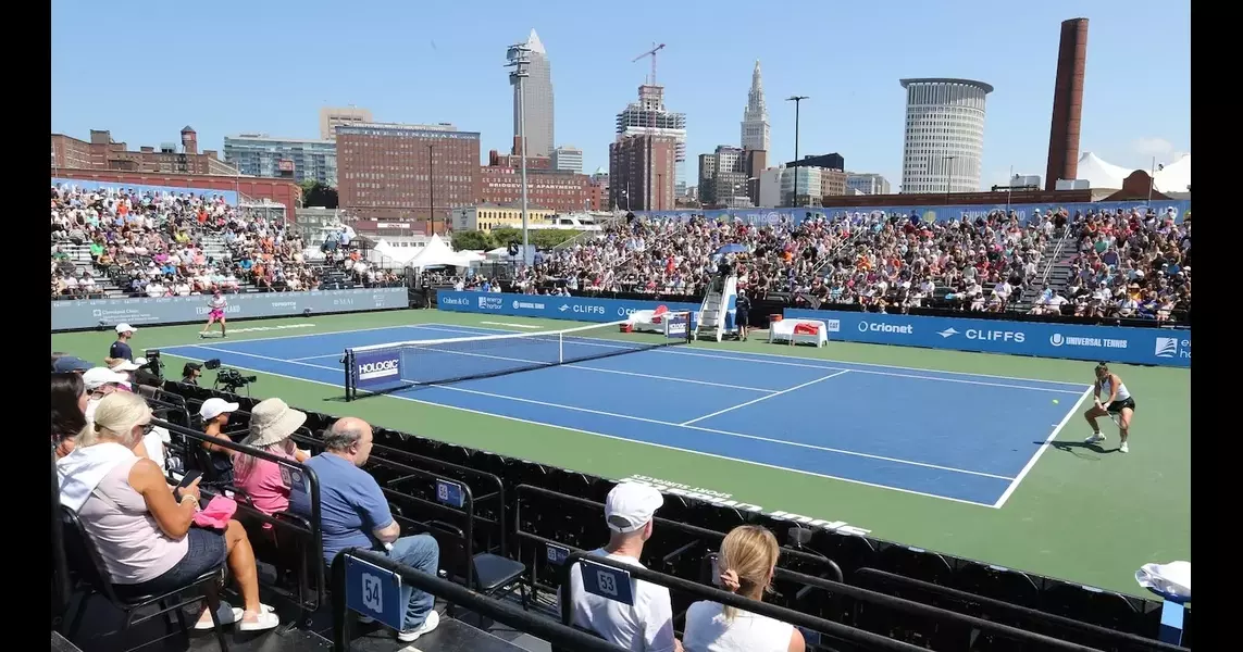 Tennis in the Land signs presenting sponsor