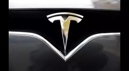 Tesla driver says his car malfunctioned and started accelerating after a head-on collision with a Jeep