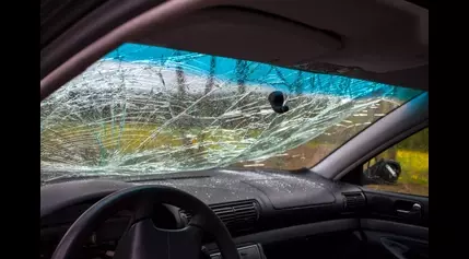 WATCH: Large Piece Of Metal Impales Car Windshield As It Cruises On Highway