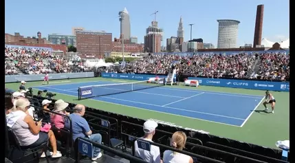 Tennis in the Land signs presenting sponsor