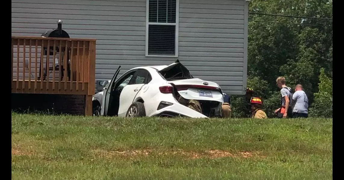 Car crashes into power pole, house in Lexington