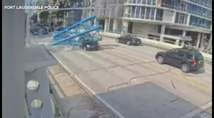 Woman walks away from FL construction accident after heavy crane crushes car