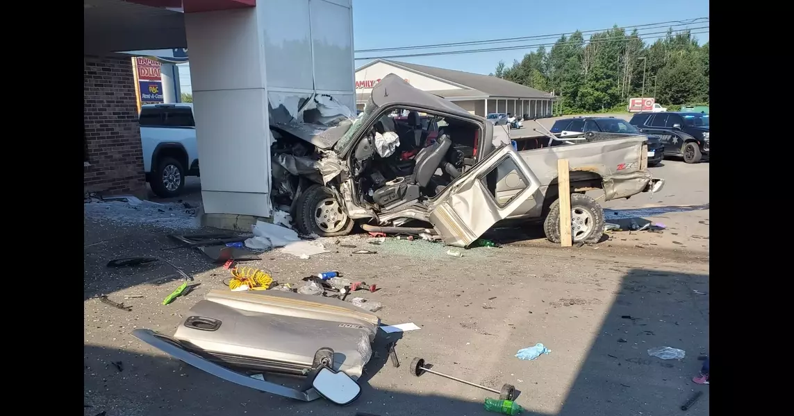 Man injured when truck crashes into Houlton car dealership