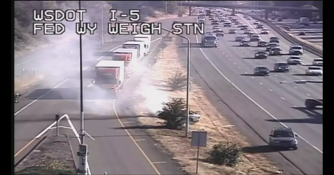 Car fire on northbound I-5 in Federal Way triggers brush fire