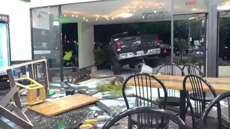 VIDEO: Truck slams into Florida bakery, crashes into parked car