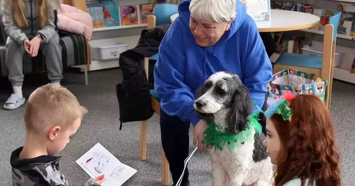 Kids can read to therapy dogs at Yorkville Library program