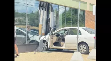 Driver crashes car through store window in Frandor