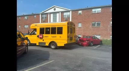 Car hits Liverpool school bus with children inside at Salina apartment complex