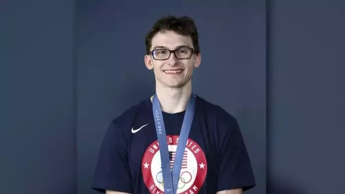 ‘Clark Kent’ gymnast inspires kids with eye conditions with Olympic medal