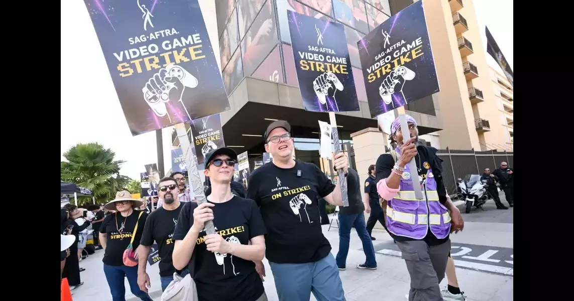 SAG-AFTRA Hits Picket Line At Warner Bros. Demanding “Baseline Of Respect” From Major Video Game Companies