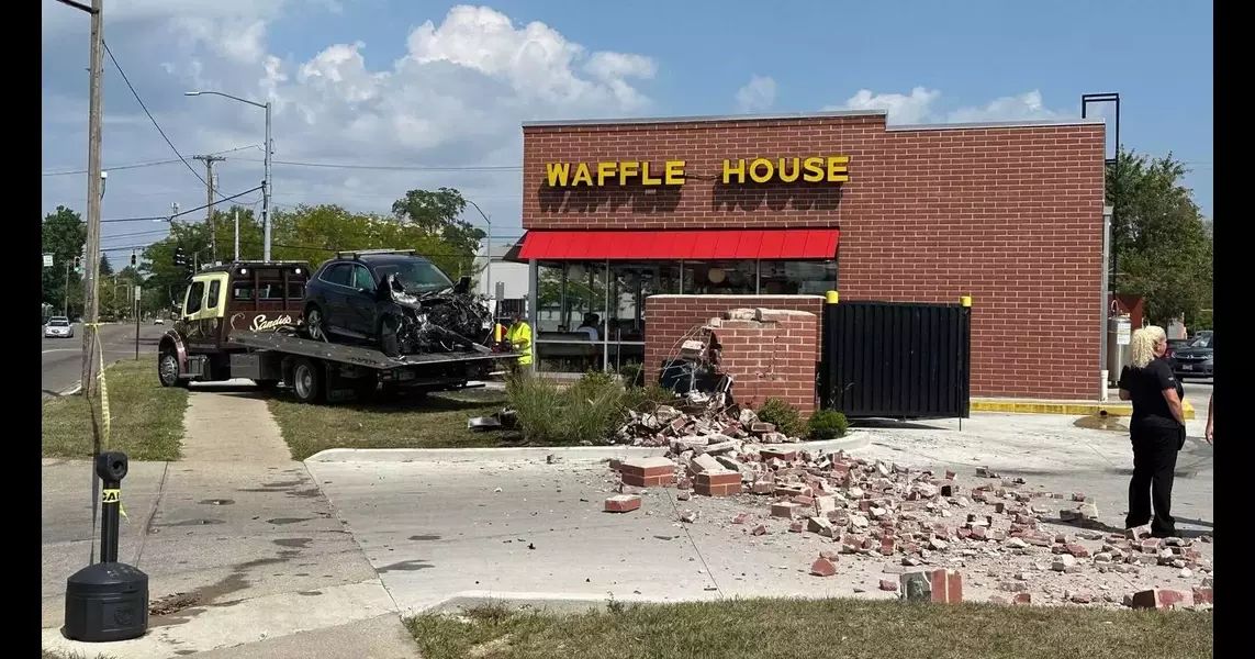 1 injured after car crashes into part of Waffle House