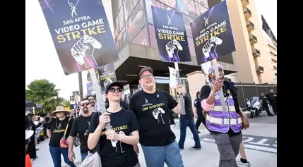 SAG-AFTRA Hits Picket Line At Warner Bros. Demanding “Baseline Of Respect” From Major Video Game Companies