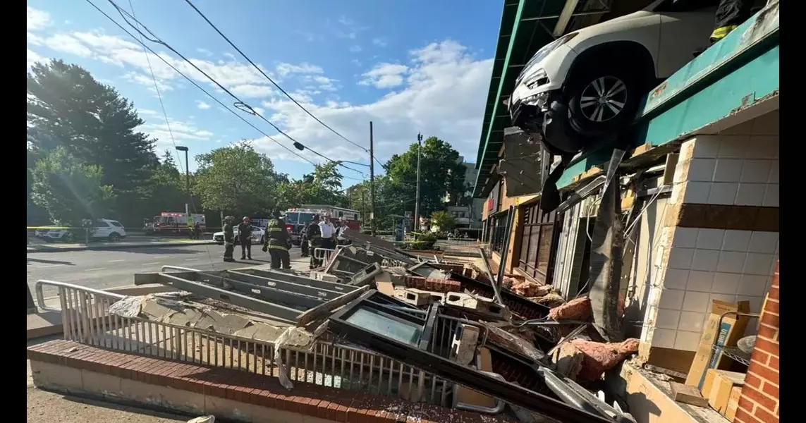 Car dangles out of Tenleytown Whole Foods garage