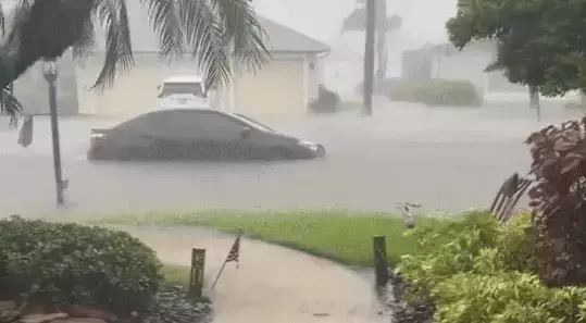 Car Partially Submerged as Debby Floods Sarasota Streets