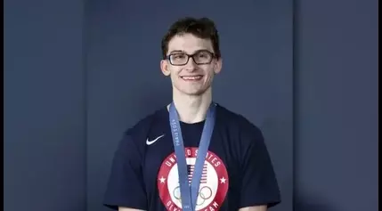 ‘Clark Kent’ gymnast inspires kids with eye conditions with Olympic medal