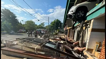 Car dangles out of Tenleytown Whole Foods garage