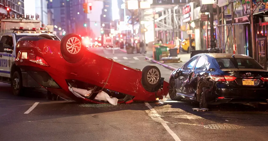 NYC crash leaves two injured, one car overturned in Midtown