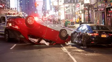 NYC crash leaves two injured, one car overturned in Midtown