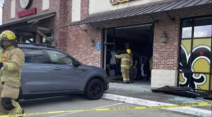 Car runs into Siegen Lane storefront; one person taken to hospital