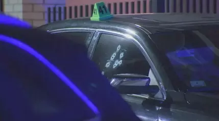 Boston shooting leaves car riddled with bullets, ground littered with evidence markers